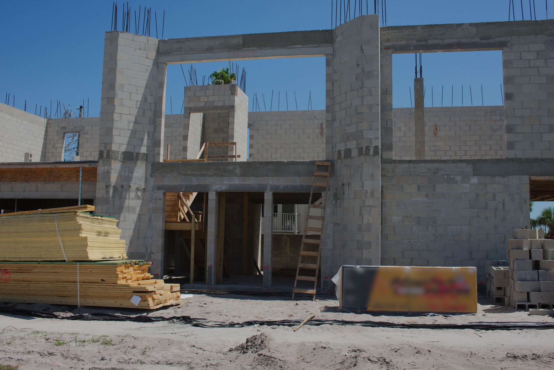 Residential two story Building Under Construction With Materials and Tools Onsite