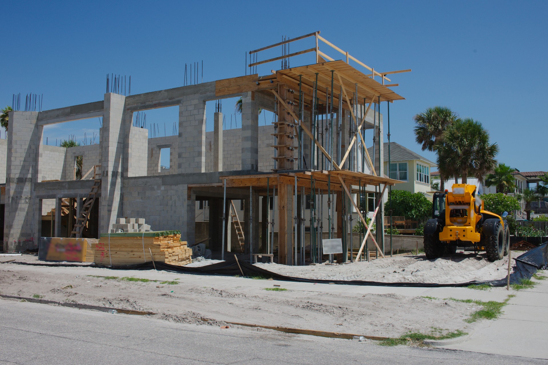 Residential two story Building Under Construction With Materials and Tools Onsite